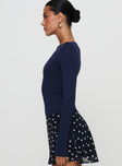 side view of model wearing Princess Polly Nikoli Long Sleeve Top Navy Full Sleeves Boat Neck 