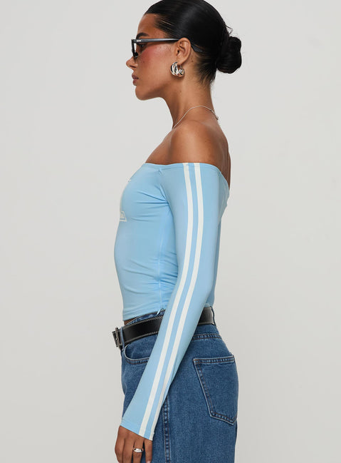 side view of model wearing Princess Polly One And Only Long Sleeve Top Blue Full Sleeves straight 