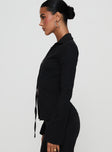 side view of model wearing Princess Polly Nataline Long Sleeve Top Black Full Sleeves Plunger 