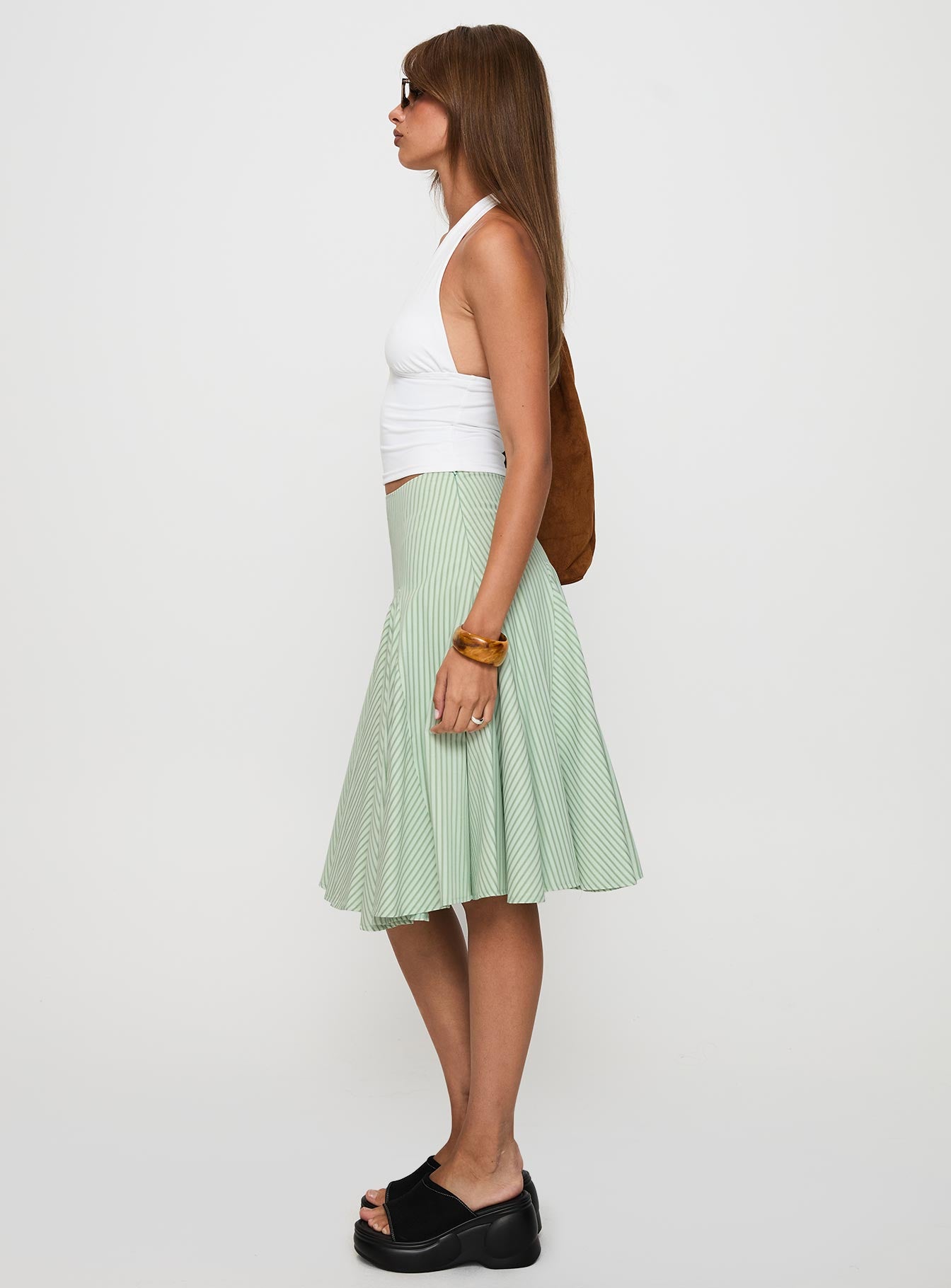   side view of model wearing Princess Polly Evangaleine Pleat Midi Skirt Green / White Midi Skirts 