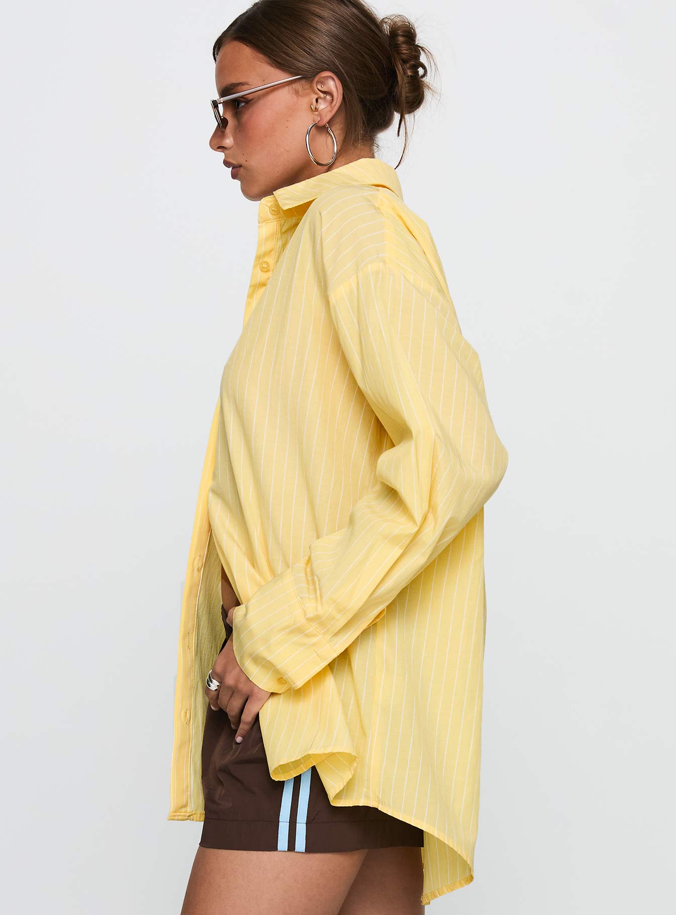 side view of model wearing Princess Polly Thousand Miles Oversized Long Sleeve Top Yellow Full Sleeves V-Neck 