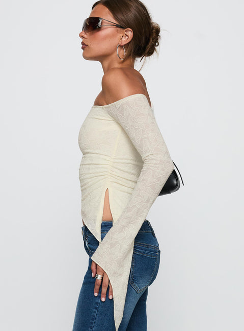 side view of model wearing Princess Polly Face Card Long Sleeve Top Cream Full Sleeves Asymmetric Neckline 