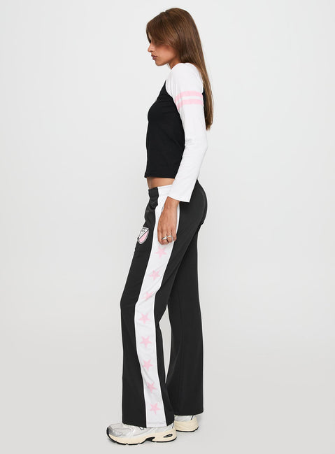 side view of model wearing Princess Polly Track Star Pants Black Low Rise Pants 