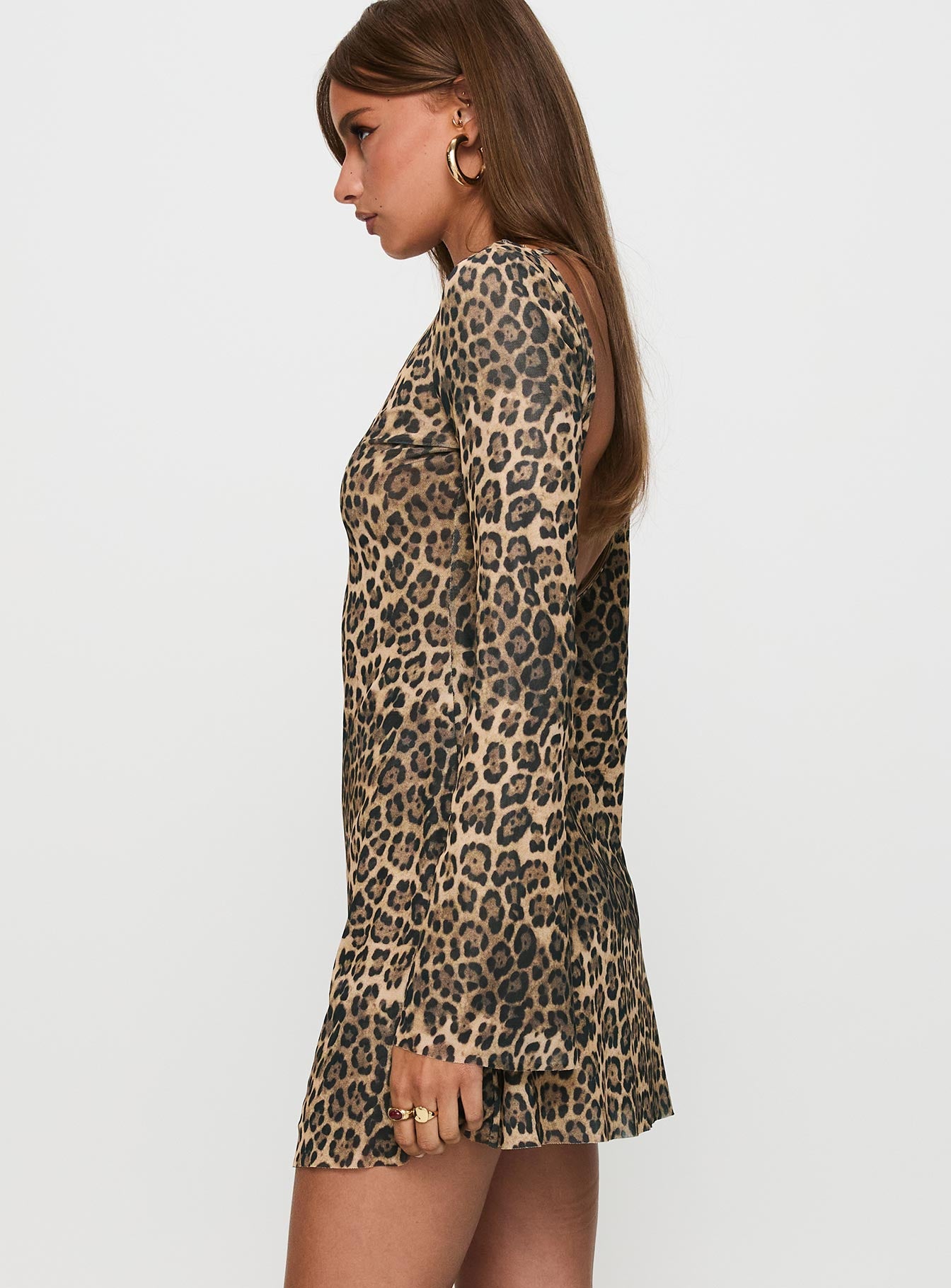 side view of model wearing Princess Polly Lukea Long Sleeve Mini Dress Leopard Boat Neck 