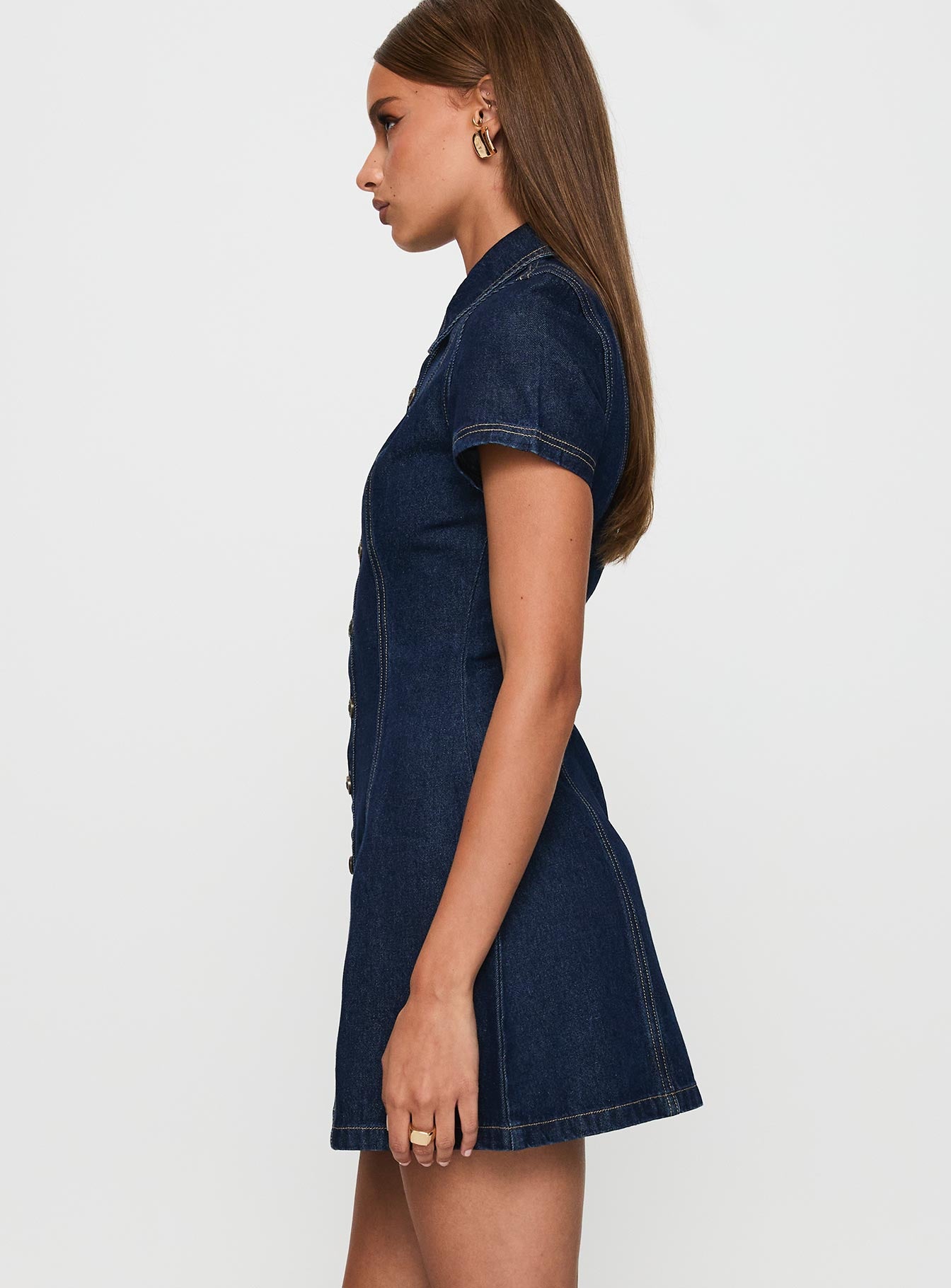 side view of model wearing Princess Polly Perception Denim Mini Dress Mid Wash High Neck 