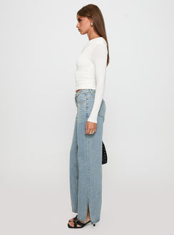 side view of model wearing Princess Polly White Mustang Side Split Jean Light Blue Mid Rise 