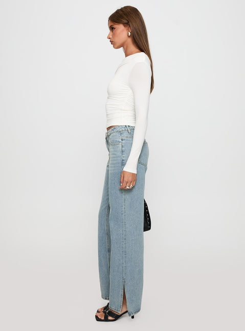 side view of model wearing Princess Polly White Mustang Side Split Jean Light Blue Mid Rise 
