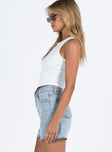 side view of model wearing Princess Polly Laurena Denim Shorts Lower Impact High Waisted Shorts 