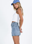 side view of model wearing Princess Polly Tropicana Shorts Denim Lower Impact High Waisted Shorts 