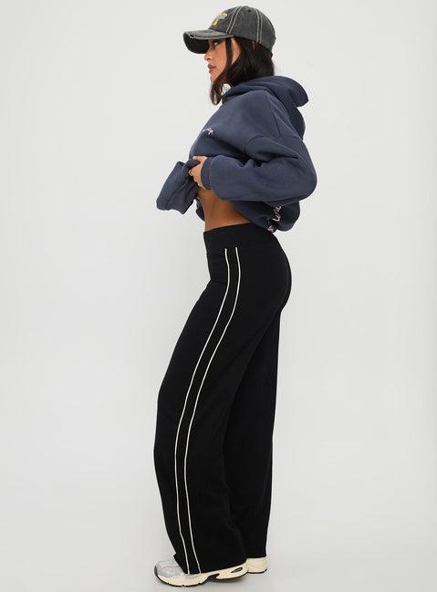 side view of model wearing Princess Polly Ascenda Straight Leg Track Pant Black High Waisted Pants 