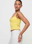 side view of model wearing Princess Polly Dalma Twist Top Yellow Sleeveless Sweetheart 