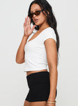 side view of model wearing Princess Polly Baseline Square Neck Rib Top White Short Sleeves Square Neck 