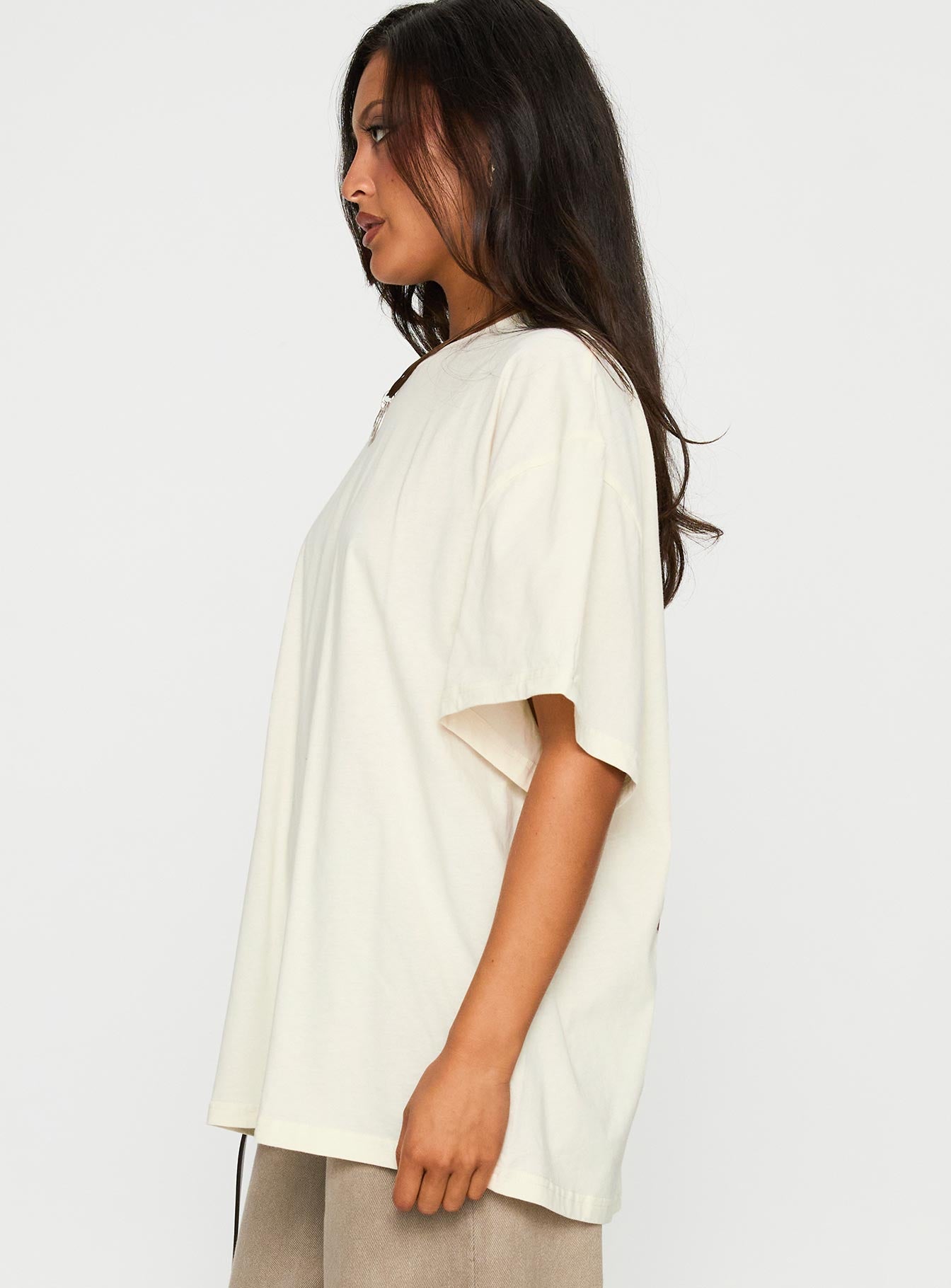 side view of model wearing Princess Polly What's In My Bag Graphic Top Cream / Multi Half Sleeves Crew Neck 