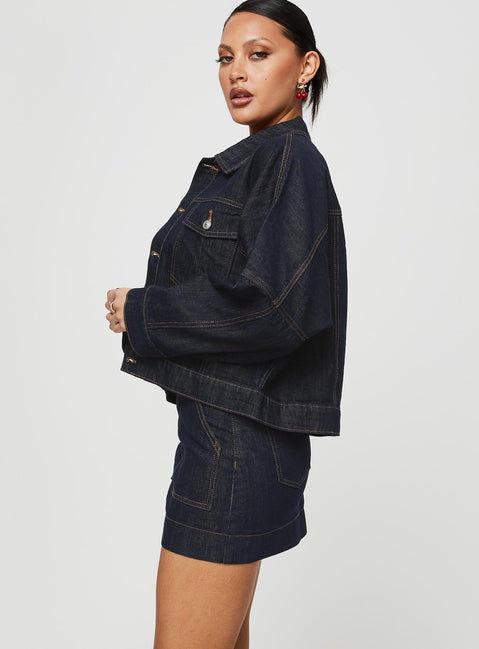   side view of model wearing Princess Polly Hughes Mini Skirt Dark Wash Denim Petite Mini Skirts 