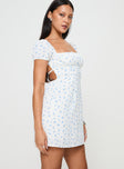 side view of model wearing Princess Polly Powells Mini Dress White / Blue Floral Square Neck 