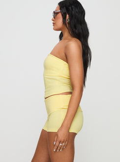 side view of model wearing Princess Polly Baseline Low Rise Rib Shorts Yellow Low Rise Shorts 