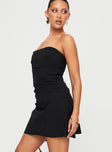 side view of model wearing Princess Polly Bradwell Strapless Mini Dress Black Petite Straight Neck 