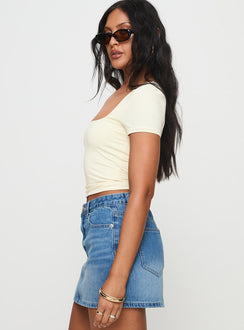 side view of model wearing Princess Polly Back In Time Short Sleeve Top Cream Short Sleeves Square Neck 