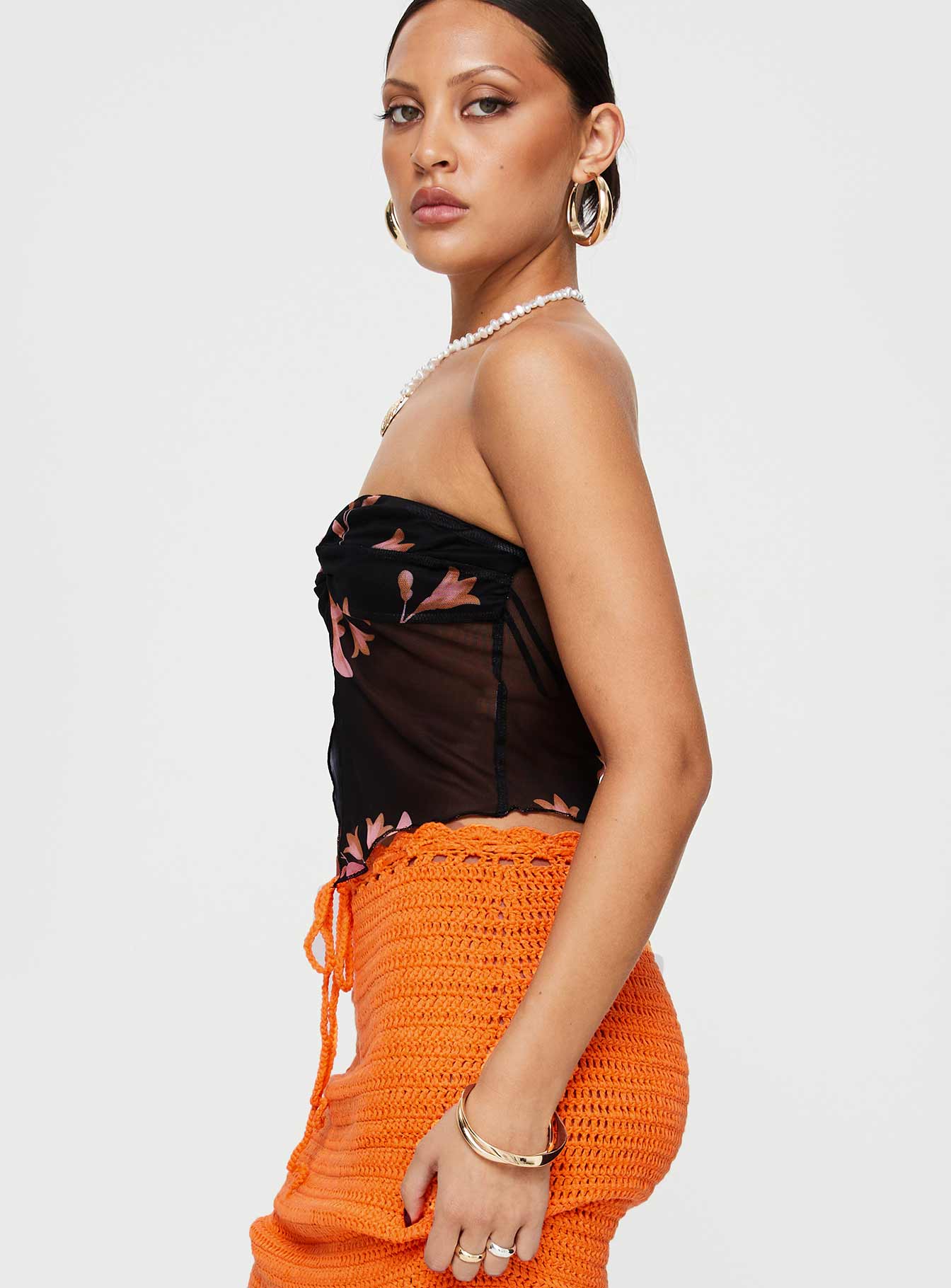 side view of model wearing Princess Polly Mani Top Black Floral Sleeveless Sweetheart 