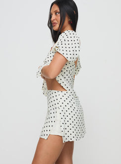 side view of model wearing Princess Polly Adios Linen Blend Skort Cream/Black High Waisted Shorts 