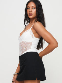 side view of model wearing Princess Polly Verbena Bodysuit White Sleeveless 