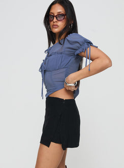 side view of model wearing Princess Polly Adios Linen Blend Skort Black High Waisted Shorts 