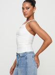 side view of model wearing Princess Polly Elowyn Top White Sleeveless Asymmetric Neckline 