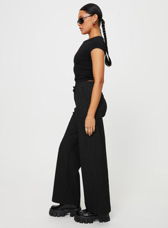 side view of model wearing Princess Polly Jeller Pinstripe Pants Black Tall High Waisted Pants 