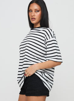 side view of model wearing Princess Polly Nersa Oversized Tee Black/white Stripe Half Sleeves Crew Neck 