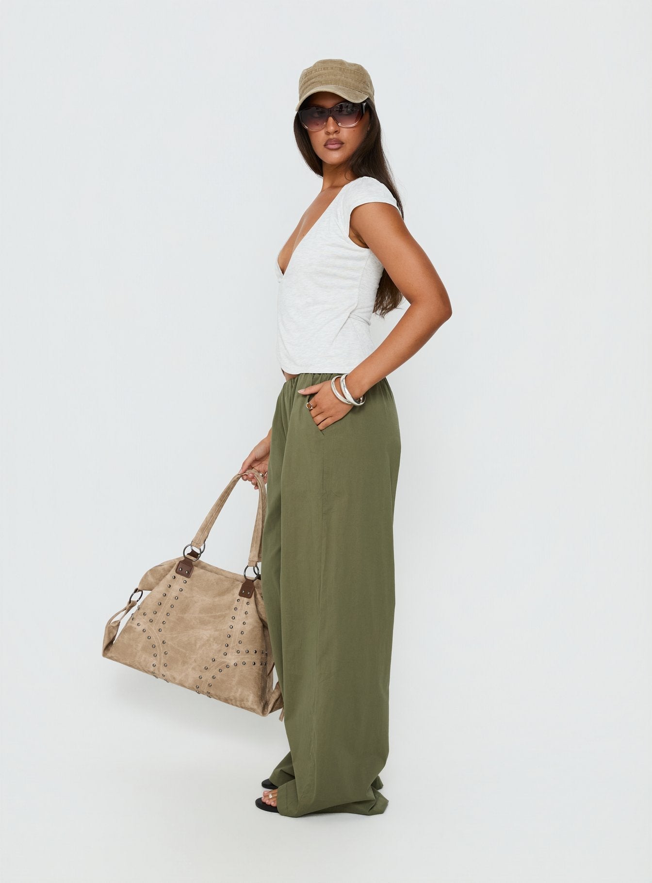 side view of model wearing Princess Polly Lunea Concealed Waistband Pants Khaki Low Rise Pants 