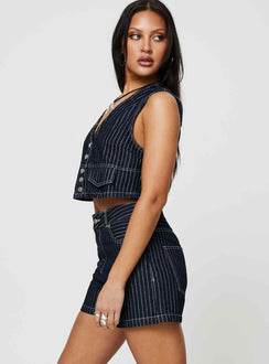 side view of model wearing Princess Polly Rathlyn Pinstripe Shorts Dark Denim High Waisted Shorts 
