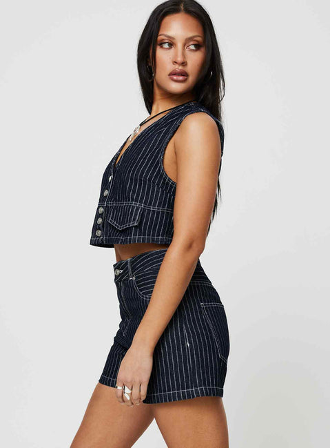 side view of model wearing Princess Polly Rathlyn Pinstripe Shorts Dark Denim High Waisted Shorts 