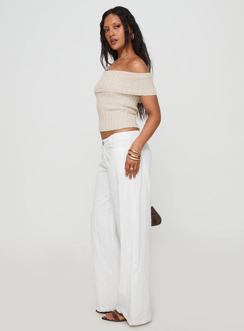 side view of model wearing Princess Polly Vendi Low Rise Pant White Petite Low Rise Pants 
