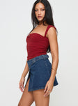   side view of model wearing Princess Polly Wait Up Denim Wrap Mini Skirt Mid Wash Tall Mini Skirts 