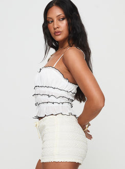side view of model wearing Princess Polly Kiwi Top White Sleeveless Square Neck 