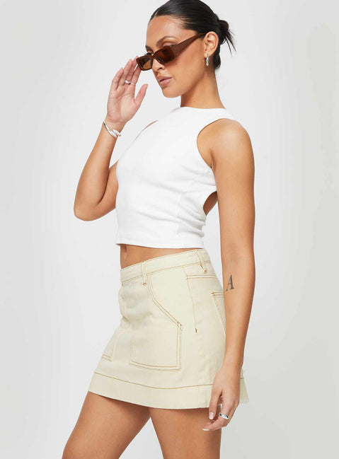   side view of model wearing Princess Polly Hughes Mini Skirt Cream Denim Mini Skirts 