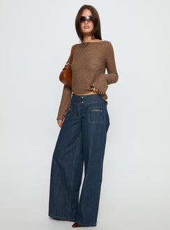 side view of model wearing Princess Polly Unwritten Mid Rise Wide Leg Jeans Dark Blue Wash Mid Rise Jeans 