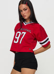 side view of model wearing Princess Polly SDSU Football Jersey Red Half Sleeves V-Neck 