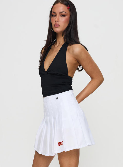  side view of model wearing Princess Polly USC Tennis Skort White 