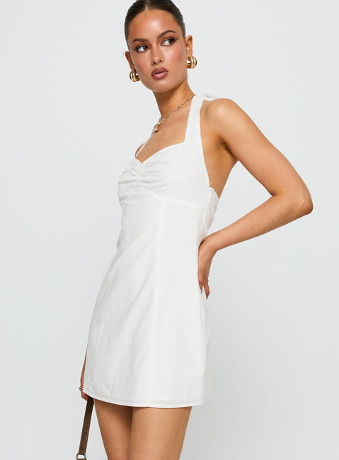 side view of model wearing Princess Polly Journey On Halter Mini Dress White Sweetheart Neckline 