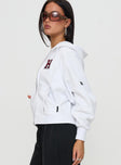 side view of model wearing Princess Polly Harvard Raglan Zip Up White / Red 