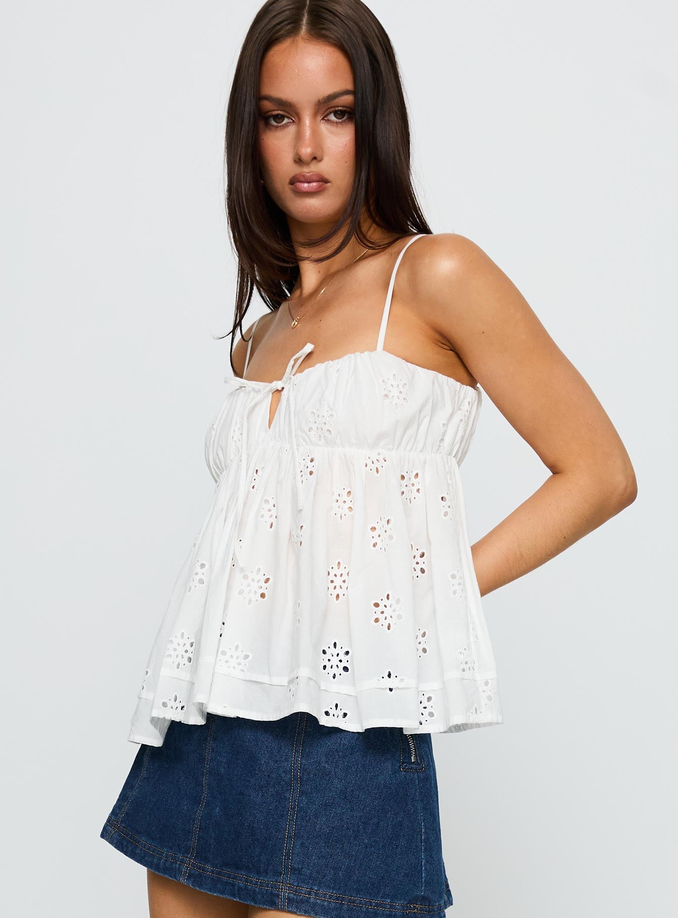 side view of model wearing Princess Polly Moving Forward Tie Detail Top White Sleeveless Square Neck 