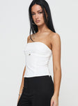 side view of model wearing Princess Polly Flounce Strapless Top White Sleeveless straight 