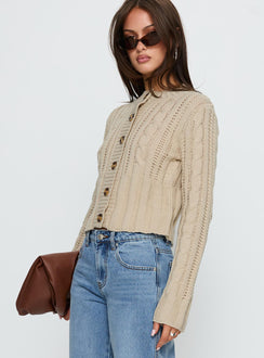 side view of model wearing Princess Polly Donielle Cable Knit Cardigan Beige cropped 