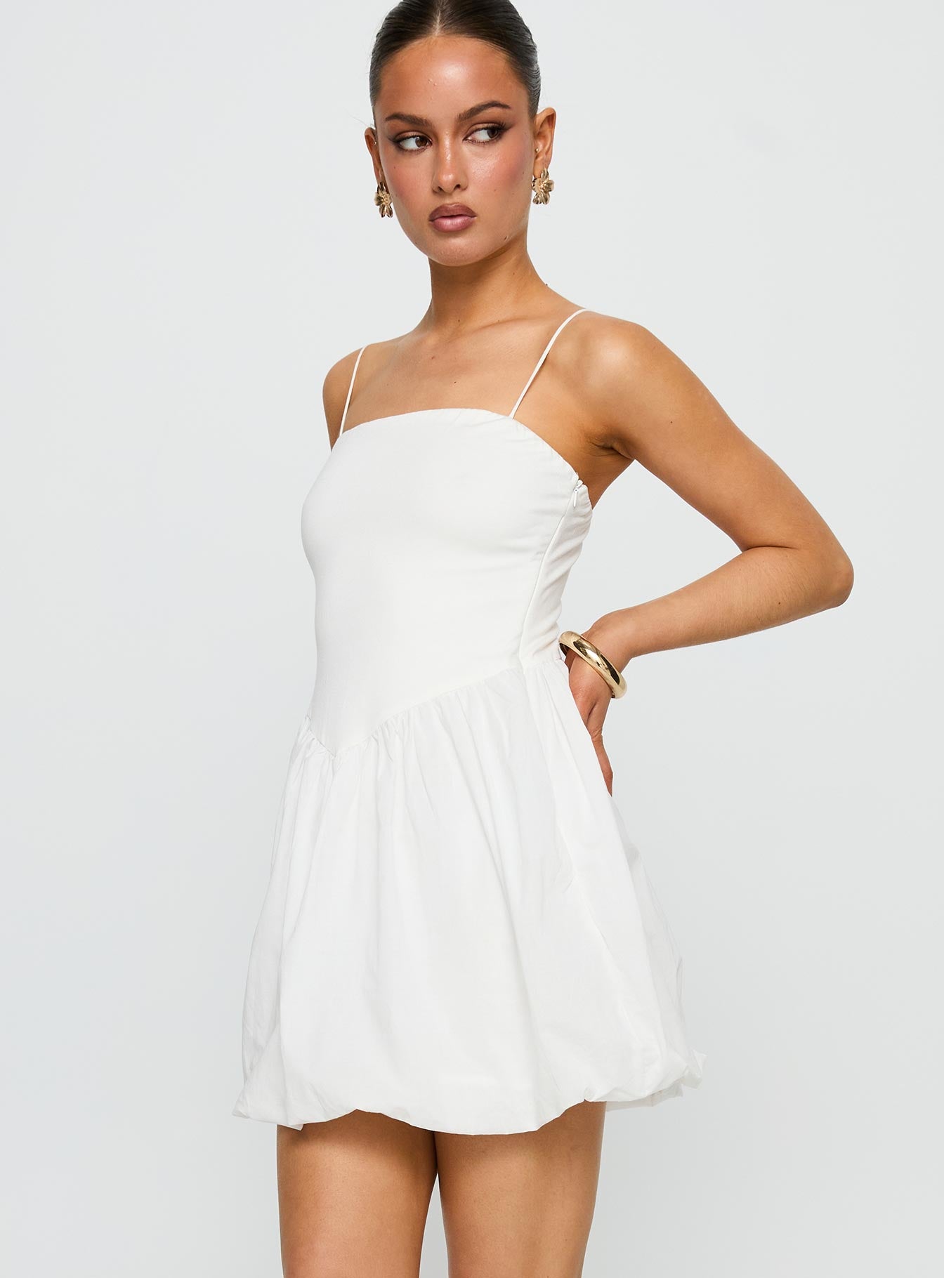 side view of model wearing Princess Polly Vista Amora Bubble Hem Mini Dress White Square Neck 