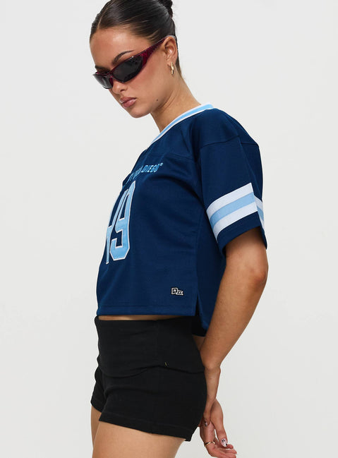 side view of model wearing Princess Polly USD Football Jersey Navy Half Sleeves V-Neck 
