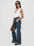 side view of model wearing Princess Polly Florida Keys Cuffed Jeans Mid Blue High Waisted 