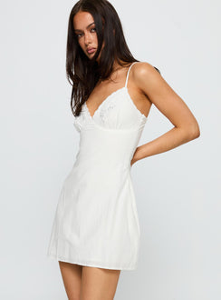 side view of model wearing Princess Polly Aruba Embroidered Mini Dress White Plunger 