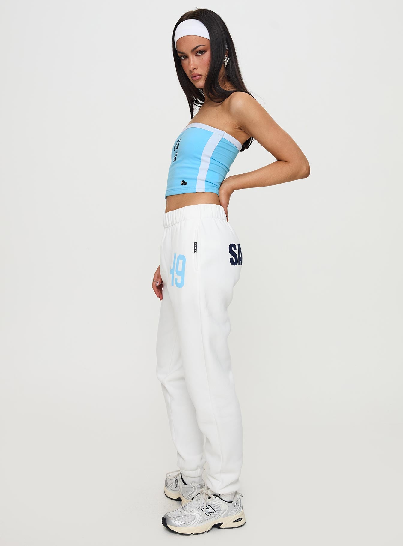 side view of model wearing Princess Polly USD Sweatpants White High Waisted Pants 