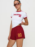 side view of model wearing Princess Polly USC Soffee Shorts Red High Waisted Shorts 